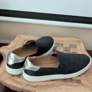 UGG Black Slip-On Sneakers with Silver Detail